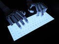 Robot typing on fluorescent keyboard