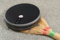 Robot vacuum cleaner on a broom