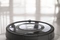 Robot vacuum cleaner on a tiled floor close-up