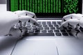 Robot Working On Laptop Royalty Free Stock Photo