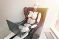 Robot working with laptop while sitting in armchair. Artificial intelligence robotic concept