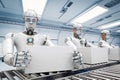 Robot working with white boxes Royalty Free Stock Photo