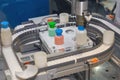 Robot works on a conveyor for the production of medical drugs Royalty Free Stock Photo