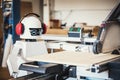 A robot works fully automatically in a carpentry workshop