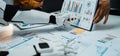 Robotic Arm Analyzing Data Charts and Graphs, Office Setting, Future Technology Integration, Informative Presentation Royalty Free Stock Photo