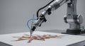 Robotic arm artistically creating a floral pattern on white surface in studio environment Royalty Free Stock Photo