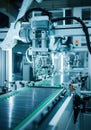 Robotic arm assembling circuit boards on a modern production line