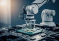 Robotic arm assembling a computer processor on a circuit board Royalty Free Stock Photo