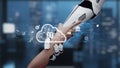 Futuristic robotic arm interacting with cloud technology and digital icons in a modern workspace representing innovation Royalty Free Stock Photo