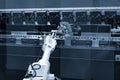 The robotic arm operation by gripping the sheet metal parts to the hydraulic press machine. Royalty Free Stock Photo