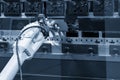 The robotic arm operation at hydraulic bending machine.
