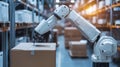 Robotic arm packing box in a warehouse setting Royalty Free Stock Photo