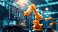 Robotic arm working with computer screen displaying data in factory setting Royalty Free Stock Photo