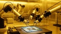 Robotic arms perform precise microassembly tasks on a semiconductor chip inside a cleanroom environment Royalty Free Stock Photo