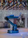 Robotic Bartender Pouring a Drink, robotic arm Royalty Free Stock Photo