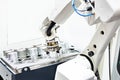 Robotic arm and metal workpieces Royalty Free Stock Photo