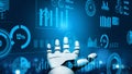 Futuristic robotic hand reaching towards digital charts and glowing graphs showcasing statistics and data analytics in a Royalty Free Stock Photo