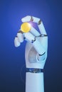 Robotic hand holding an bitcoin on blue background. 3d illustration Royalty Free Stock Photo