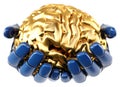 Robotic hand holding golden human brain