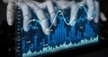 Robotic Hand Interacting with Digital Financial Graphs and Data Visualization on Virtual Screen Displaying Stock Market Royalty Free Stock Photo