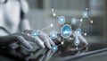 Robotic hand interacting with digital icons representing technology, data analytics, and artificial intelligence Royalty Free Stock Photo