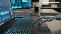 Robotic hand interacting with a laptop keyboard displaying glowing blue data visualizations and charts Keywords Royalty Free Stock Photo