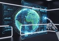 A robotic hand interacts with a futuristic digital interface displaying a globe Royalty Free Stock Photo