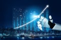 Robotic Hand Pointing at Digital Graph with Ascending Trend Over Cityscape Night Background Impute Royalty Free Stock Photo