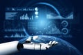 Futuristic robotic hand presenting digital charts and graphs over a globe with data analytics interface in the Royalty Free Stock Photo