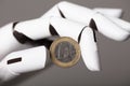 Robotic Hand Showing One Euro Coin Royalty Free Stock Photo