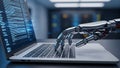 Robotic Hand Typing on a Laptop Keyboard with Lines of Code Displayed on the Screen Keywords: robot, hand, laptop Royalty Free Stock Photo