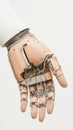Robotic hand with visible wiring and mechanical joints, suggesting advanced technology and precision engineering for space Royalty Free Stock Photo
