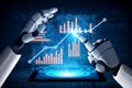 Robotic Hands Interacting with Data Visualization on Tablet Screen Displaying Growth Trends and Graphs in Futuristic Royalty Free Stock Photo