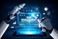 Robotic Hands Interacting with Digital Risk Management Interface Verifying Data Analytics and Control Metrics in a Royalty Free Stock Photo