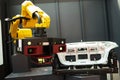 Robotic industry. Robot with 3D sensor scanner measures surface of detail in automotive industry
