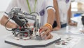 Robotic lab class with school students blur background in AI learning or group study workshop in science technology engineering