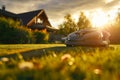 Robotic lawn mower on a backyard with fresh green grass and morning sunlight