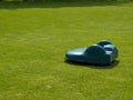 Robotic lawn mower on grass