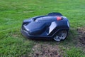 Robotic lawn mower on grass