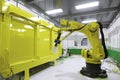 robotic painting and coating system, with a view of the factory floor, in action