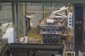 Robotic palletizer working with plastic beer bottles at brewery plant