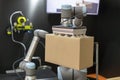 Robotic or robot arm for cardboard box packing