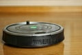 Robotic vacuum cleaner cleaning under the sofa, technological progress, matte effect