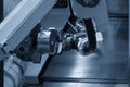 The robotics arm gripping the metal part from CNC lathe machine with lighting effect. Royalty Free Stock Photo