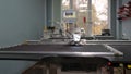 Robotics with cnc works in sewing a production line. Robot sewing machine. computer controls sewing machine. automatic