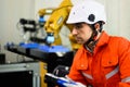 Robotics controller engineer working and solving problems on machine Royalty Free Stock Photo