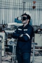 Robotics experts wear virtual reality goggles to help teammates with remote support