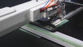 Robotics works in the tailoring production line. The computer controls the sewing machine. needle embroidery pattern on