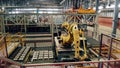 Robotized complex, robot manipulator worling at modern factory.