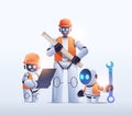robots engineers holding construction drawings modern robotic architects with blueprints artificial intelligence Royalty Free Stock Photo